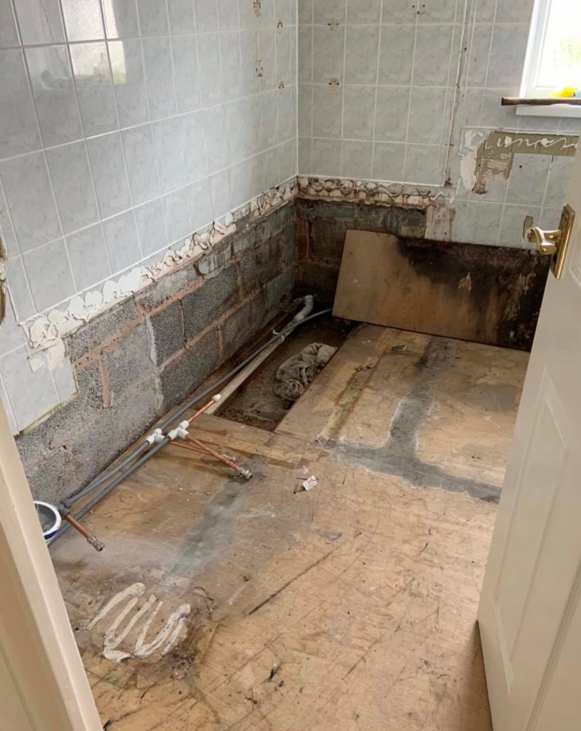 Bathroom leak remediation and refit : before, during and after