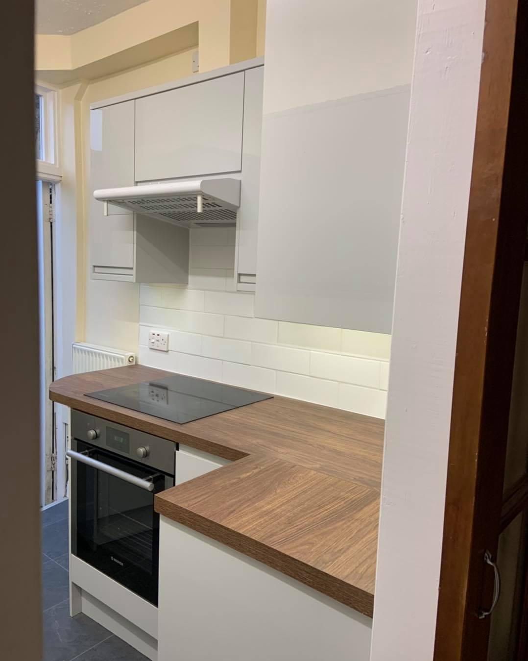 Kitchen water leak remediation and refit : before, during and after