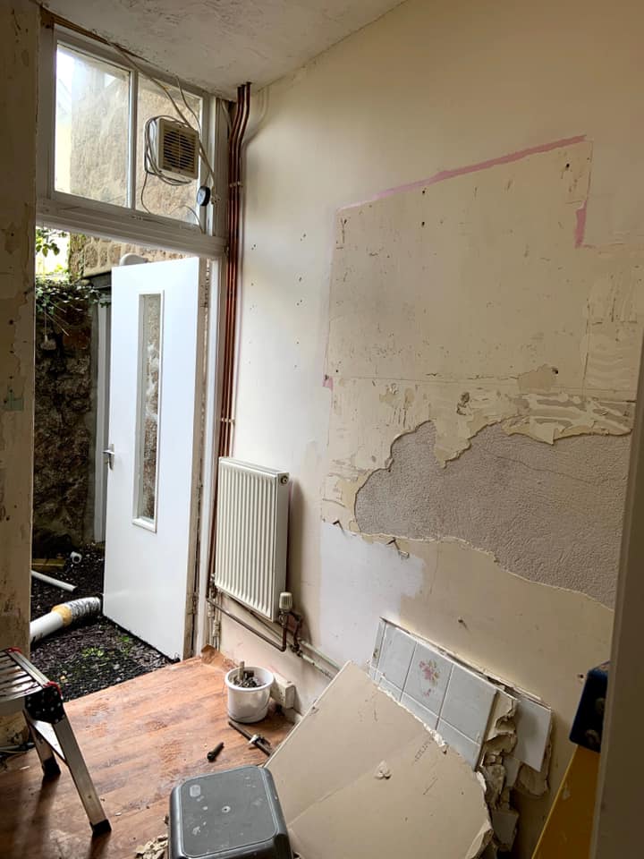Kitchen water leak remediation and refit : before, during and after